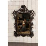 An ebonised walnut rococo-style mirror, probably Italy, 18/19th C.