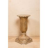 A French patinated wooden Empire style pedestal, 19th C.