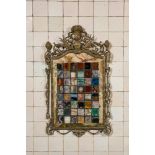 A pietra dura plaque mounted in a brass frame, 20th C.