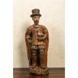 A Spanish polychrome walnut figure of a nobleman with a dove, 16/17th C.