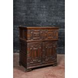 An English Jacobean style carved oak cabinet with two doors beneath a drawer, 17th C. and later