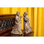 A pair of wooden figures of praying saints, 19th C. or earlier