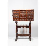 A Spanish wooden 16th-C. style 'bargue–o' cabinet on foot, 19th C.