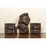 A carved oak cherub's head and a pair of 'Lamb of God' panels, 17th C.