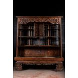 A large Chinese carved and reticulated wooden etagere, 19th C.