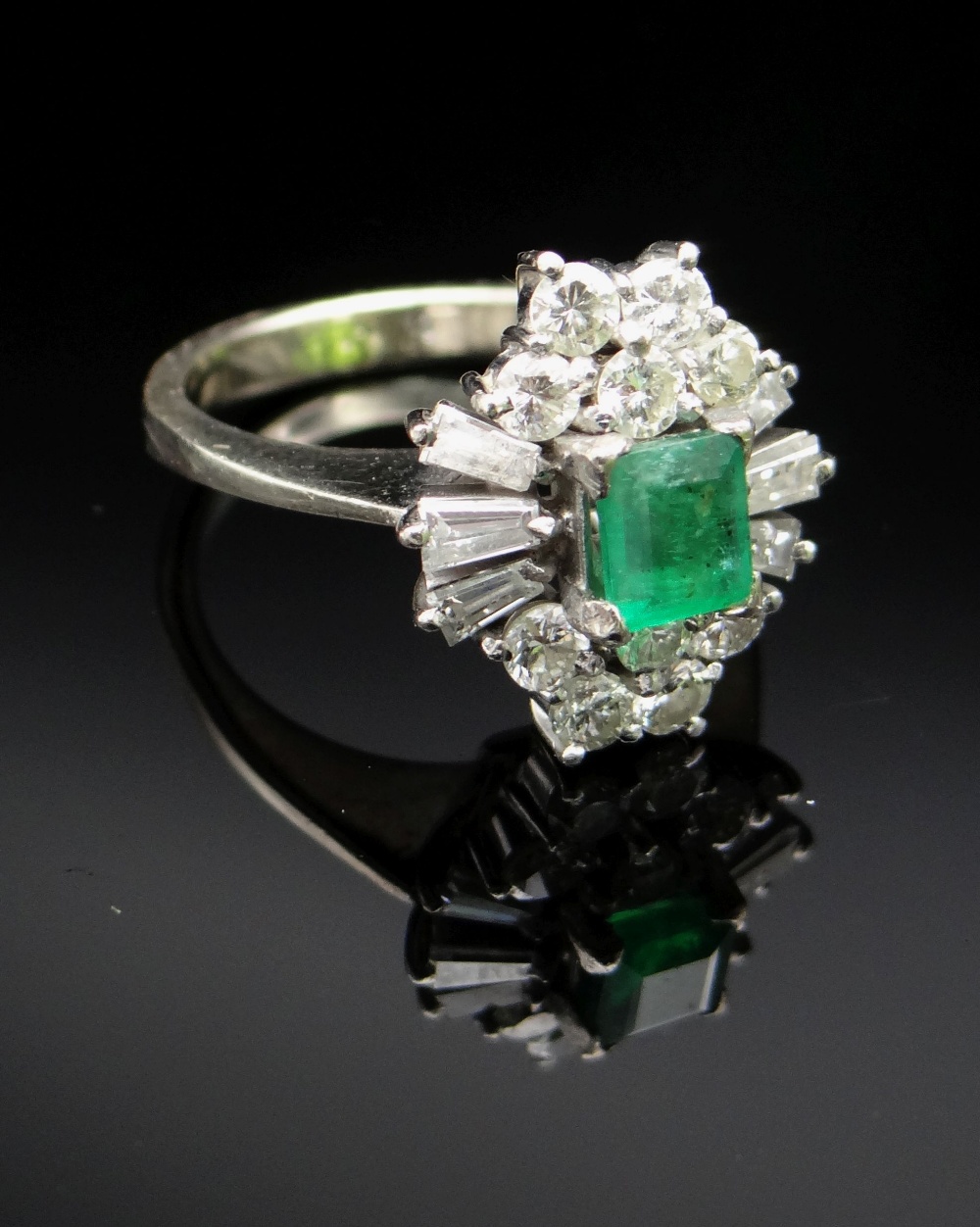 18CT WHITE GOLD EMERALD & DIAMOND CLUSTER RING, the central emerald (5 x 4mms approx.) surrounded by