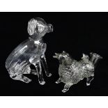 TWO NOVELTY GLASS ANIMAL FLASKS, comprising a seated spaniel, 18cms h, and a standing sheep 15cms