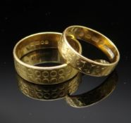 TWO 22CT GOLD ENGRAVED WEDDING BANDS, 7.0gms overall (2) Provenance: deceased estate Powys,