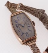 9CT GOLD LADIES ART DECO-STYLE SWISS WRISTWATCH, c. 1923, tonneau case and silvered dial with blue