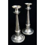 PAIR CONTINENTAL WHITE METAL EGYPTIAN REVIVAL CANDLESTICKS, tapering cylindrical columns with