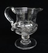 EARLY 19TH CENTURY BALUSTER GLASS CREAM JUG, c. 1830, threaded rim, scroll handle and flammiform