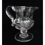 EARLY 19TH CENTURY BALUSTER GLASS CREAM JUG, c. 1830, threaded rim, scroll handle and flammiform