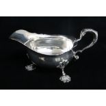 GEORGE V SILVER SAUCE BOAT, Collingwood & Co, London 1930, cut card rim, scrolled handle and shell
