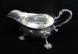 GEORGE V SILVER SAUCE BOAT, Collingwood & Co, London 1930, cut card rim, scrolled handle and shell