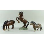 THREE BESWICK HORSES, comprising no. 1050 Shirehorse grazing,13.5cms; no. 1014 Rearing Welsh Cob,