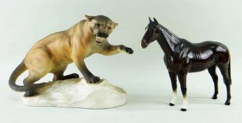 TWO BESWICK FIGURES comprising 1702, Mountain Lion or Cougar, in matt glaze, 32cms wide, and
