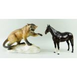 TWO BESWICK FIGURES comprising 1702, Mountain Lion or Cougar, in matt glaze, 32cms wide, and