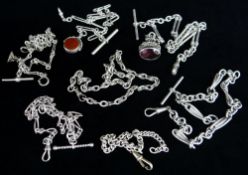 SEVEN SILVER WATCH CHAINS of various design one with revolving bloodstone and carnelian fob, another
