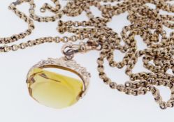 9CT GOLD REVOLVING CITRINE FOB, on long 9ct gold guard chain, 150cms long, 35.3gms overall