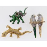 THREE ANIMAL DESIGN BAR BROOCHES to include enamel elephant, stone set lizard and pair of parrots (