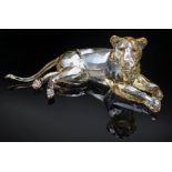 SWAROVSKI TINTED CRYSTAL MODEL RECUMBENT LIONESS, 8cms long Comments: no boxes or certificates