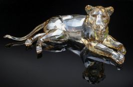SWAROVSKI TINTED CRYSTAL MODEL RECUMBENT LIONESS, 8cms long Comments: no boxes or certificates