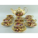 AYNSLEY BONE CHINA 'ORCHARD GOLD' TEAWARE comprising six cups and saucers signed 'N. Brunt' and an