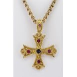 18CT YELLOW GOLD CROSS PENDANT set with central sapphire and four rubies, on 15ct gold chain