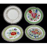 FOUR SWANSEA POTTERY RIBBON PLATES each with typical basket-weave borders, three painted with