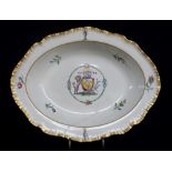ARMORIAL DISH ATTRIBUTED TO SWANSEA, earthenware with feathered edge and centred coat of arms in