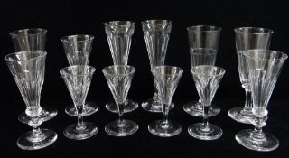 FOUR SETS OF LATE 19TH CENTURY FACET CUT GLASSES, comprising champagne flutes (3+2+3) and port