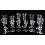 FOUR SETS OF LATE 19TH CENTURY FACET CUT GLASSES, comprising champagne flutes (3+2+3) and port