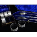 VICTORIAN BOXED SET OF NAPKIN RINGS, Matthew Boulton, Birmingham 1887, floral chase and numbered 1-6