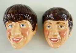 TWO KELSBORO WARE BEATLES WALL MASKS, c. 1964, depicting George and Ringo, impressed numerals 1 & 2,