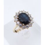 YELLOW METAL SAPPHIRE & DIAMOND CLUSTER RING, the central sapphire 9 x 7mms surrounded by fourteen