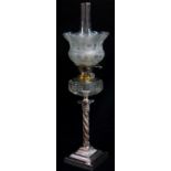 VICTORIAN ELECTROPLATED OIL LAMP, the Corinthian column base supporting clear faceted glass