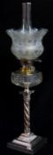 VICTORIAN ELECTROPLATED OIL LAMP, the Corinthian column base supporting clear faceted glass