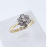 18CT GOLD SEVEN-STONE DIAMOND RING, of flower head cluster design, ring size P, 2.7gms Provenance:
