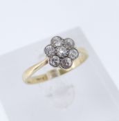 18CT GOLD SEVEN-STONE DIAMOND RING, of flower head cluster design, ring size P, 2.7gms Provenance: