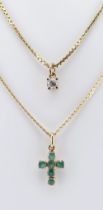 TWO YELLOW GOLD PENDANTS ON CHAINS comprising emerald crucifix on chain stamped '750', together with
