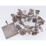 SILVER BRACELET WITH HEART SHAPED PADLOCK having various white metal charms, together with four