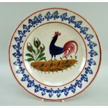 LLANELLY POTTERY COCKEREL PLATE, continuous sponged arrow point border, 25cms diam Provenance: