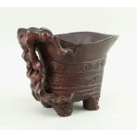 CHINESE CARVED & STAINED BAMBOO LIBATION CUP, simulating Rhinoceros horn, 10cms high Comments: