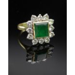 18CT GOLD EMERALD & DIAMOND CLUSTER RING, the central square emerald (7 x 7mms) surrounded by a