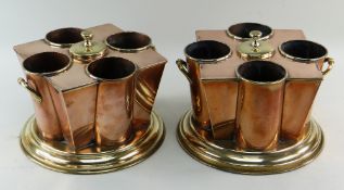 PAIR COPPER & BRASS WINE COOLERS, each with four bottle sleeves around a central lidded ice