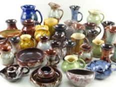 LARGE ASSORTMENT OF EWENNY POTTERY, mainly jugs, vases, flower bowls and chamber sticks (38) *