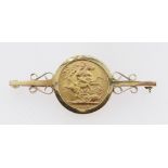 ELIZABETH II GOLD SOVEREIGN BROOCH, 1968, set in 9ct gold scroll mount, 12.0gms Provenance: