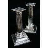 PAIR EDWARD VII SILVER CANDLESTICKS, Thomas A. Scott, Sheffield 1905, fluted form with beaded drip