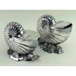 TWO ELECTROPLATED NAUTILUS SHELL SPOON WARMERS, the smaller by Elkington & Co, 15.5 and 15.5cms (2)