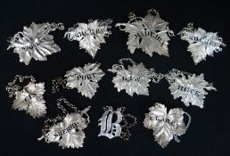 COLLECTION OF ELEVEN DECANTER LABELS, comprising nine hallmarked silver labels, eight of pierced